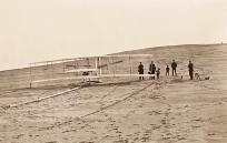 Among the locals helping the Wrights were Tom Beacham (second from right) with young son John and his dog Bounce.