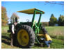 Dr. George Conway and Dr. Tony McKenzie evaluate a tractor on a New York farm. 