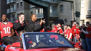 Utah linebacker Stevenson Sylvester (10), Utah head coach Kyle Whittingham and Utah quarterback Brian Johnson (3) ride down State Street Friday in the parade Salt Lake City threw to celebrate Utes defeat over Alabama 31-17 in the  Sugar Bowl. (Laura Seitz, Deseret News)