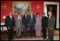 President George W. Bush poses for a photo in the Red Room of the White House, Friday, Oct. 7, 2005, with recipients of the President's Volunteer Service Awards, honored in celebration of Hispanic Heritage Month. From left to right with President Bush are John Diaz of Crowley, Colo., Manuel Fonseca of Nashville, Tenn., Marie Arcos of Houston Texas, Maria Hines of Albuquerque, N.M., Eleuterio "Junior" Salazar of Bradenton, Fla. and Dr. Elmer Carreno of Silver Spring, Md.  White House photo by Shealah Craighead