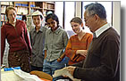 Professor Hiroo Kanamori instructing grad students & post-docs