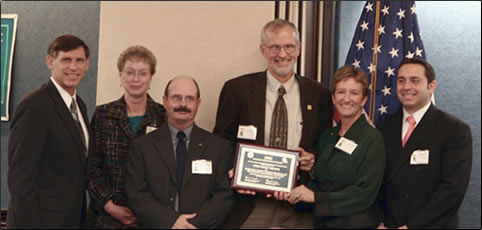 Pictured in the photo, from left to right, are: J. Richard Capka, Federal Highway Administration Acting Administrator; Donna Sheehy, Forest Service Traffic Management Engineer in Region 1 (Montana); Doug Moeller of the Montana Department of Transportation; John Bell, Forest Service National Road System Operations and Maintenance Engineer (Washington, DC); Sally Collins, Forest Service Associate Chief (Washington, DC); and Gregory Cohen, Roadway Safety Foundation Executive Director. 