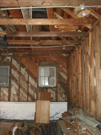 garage interior before ceiling joist removal