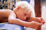 A boy lying on a sofa