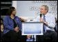 President George W. Bush leads the discussion on stage with Cynthia Roberts, a Nissan employee, during a Conversation on Strengthening Social Security Tuesday, May 3, 2005 at the Nissan North America Manufacturing Plant in Canton, Miss.  White House photo by Eric Draper