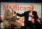 President George W. Bush speaks with retired senior Peter Navarro during A Conversation on the Medicare Prescription Drug Benefit at the Asociacion Borinquena de Florida Central, Inc., in Orlando Wednesday, May 10, 2006. White House photo by Eric Draper