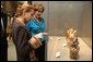 Elaine Karp de Toledo, First Lady of Peru, explains artifacts on display to Laura Bush during a visit to view the exhibit "Peru: Indigenous and Viceregal," at the National Geographic Society Friday, Feb. 25, 2005 in Washington, D.C. Also present is John Fahey, Jr., President and CEO of National Geographic Society.  White House photo by Susan Sterner