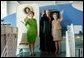 President George W. Bush, Laura Bush and Nancy Reagan wave after touring the plane that served as Air Force One for President Ronald Reagan and six other Presidents from 1973-2001at the Ronald Reagan Presidential Library in Simi Valley, California, Friday, Oct. 21, 2005. White House photo by Eric Draper