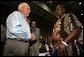 Vice President Dick Cheney visits with families who have been relocated from their homes in Louisiana and Mississippi to the Austin Convention Center in Austin, Texas Saturday, September 10, 2005. The Convention Center has been designated as one of the many temporary shelters for Katrina Hurricane evacuees.  White House photo by David Bohrer