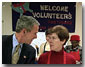 Visiting "Martha's Table" center for homeless adults and children, President George W. Bush talks with volunteer Connie Jeremiah December 20. The president helped pack sandwiches into carrying crates at the center which has been providing food to the hungry since 1980. White House photo by Eric Draper.