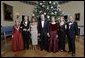 President George W. Bush and Laura Bush pose with the Kennedy Center honorees, from left to right, actress Julie Harris, actor Robert Redford, singer Tina Turner, ballet dancer Suzanne Farrell and singer Tony Bennett, Sunday, Dec. 4, 2005, during the reception in the Blue Room at the White House. White House photo by Eric Draper