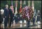 President George W. Bush stands at attention during Wreath Laying ceremonies in commemoration of Memorial Day at Arlington National Cemetery in Arlington, Virginia Monday May 31, 2004.  White House photo by Joyce Naltchayan