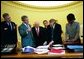 During his morning briefing, President George W. Bush reviews the progress of the war with members of the War Council Wednesday, April 2, 2003. Pictured with the President are, from left, Chairman of the Joint Chiefs of Staff Richard B. Myers, Vice President Dick Cheney, Chief of Staff Andy Card, Secretary of Defense Donald Rumsfeld and National Security Advisor Condoleezza Rice.   White House photo by Eric Draper