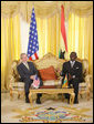 President George W. Bush and Ghana President John Agyekum Kufuor laugh together during their meeting at Osu Castle, Wednesday, Feb. 20, 2008 in Accra, Ghana. White House photo by Eric Draper