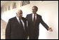 President George W. Bush and Israeli Prime Minister Ariel Sharon walk through the Rose Garden colonnade after their joint press conference Tuesday, July 29, 2003.  White House photo by Paul Morse