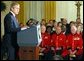 President George W. Bush makes remarks to American and British veterans ( seated in background) in the East Room of the White House on Veteran's Day, November 11, 2002  White House photo by Paul Morse