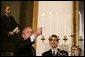 President George W. Bush participates in the Menorah lighting at the White House with Rabbi Joshua Skoff and members of the Skoff family, Tuesday, Dec. 6, 2005, prior to the annual White House Hanukkah reception.  White House photo by Kimberlee Hewitt