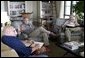 President George W. Bush meets with Secretary of State Colin Powell and Deputy Secretary of State Richard Armitage at his ranch in Crawford, Texas, Wednesday, Aug. 6, 2003.  White House photo by Susan Sterner