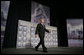 President George W. Bush walks on stage at the Renaissance Cleveland Hotel in Cleveland, Ohio, to deliver his remarks on the global war on terror, Monday, March 20, 2006, to members of the City Club of Cleveland.  White House photo by Paul Morse