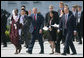 Joined by Prime Minister Tony Blair of the United Kingdom, President George W. Bush waves to the cameras as they walk with Junior G8 Student Leaders including the U.S. representative Kavitha Narra, following their meeting Thursday, June 7, 2007, in Heiligendamm, Germany. The 16-year-old is a junior at San Jose's Harker School and is one of eight students who made the trip to the J8.  White House photo by Eric Draper