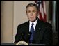 President George W. Bush delivers a live televised statement on Iraq's elections from the Cross Hall of the White House, Sunday, Jan. 30, 2005.  White House photo by Eric Draper