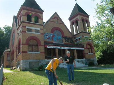 NETL researchers open a manhole cover in front of historic John Wesley AME Zion Church in Pittsburgh, PA.