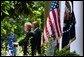 President George W. Bush and Secretary of Education Rod Paige discuss the progress of the No Child Left Behind Act in the Rose Garden Tuesday, June 10, 2003. "(The Act) requires every state in our country to submit an accountability plan that leads to measurable gains in student performance," said the President. "As of today, all of the states, plus Puerto Rico and the District of Columbia, have now submitted those plans."  White House photo by Susan Sterner