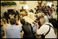 President George W. Bush shakes hands with President Mahmoud Abbas of the Palestinian Authority Thursday, May 26, 2005, as the press records the moment in the Oval Office of the White House. White House photo by Eric Draper