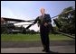 President George W. Bush speaks to the media before departing the White House Friday afternoon, August 2, 2002.  