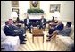 President George W. Bush, Secretary of State Colin Powell, and National Security Advisor Dr. Condoleezza Rice meet with the Foreign Ministers of Saudi Arabia, Egypt and Jordan in the Oval Office Thursday, July 18. They are (from left) Dr. Marwan Jamil Muasher of Jordan, Prince Saud Al-Faisal of Saudi Arabia and Ahmed Maher El Sayed of Egypt.  