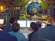 Scientists examine data received during nighttime testing of the SOFIA airborne observatory's telescope.