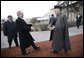 President George W. Bush is greeted by President Hamid Karzai upon arrival Monday morning, Dec. 15, 2008, at the Afghanistan leader's presidential palace in Kabul.  White House photo by Eric Draper