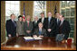 President George W. Bush prepares to sign H.R. 5946, the Magnuson-Stevens Fishery Conservation and Management Reauthorization Act of 2006, Friday, Jan. 12, 2007 in the Oval Office at the White House. President Bush is joined by, from left, Sen. Ted Stevens of Alaska, Sen. Olympia Snow of Maine, Rep. Nick Rahall of West Virginia., Rep. Jim Saxton of New Jersey, Rep. Frank Palloneof New Jersey; Rep. Don Young of Alaska, U.S. Commerce Secretary Carlos Guiterrez and Rep. Wayne Gilchrest of Maryland. White House photo by Paul Morse