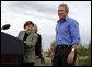 President George W. Bush is introduced by Secretary of Agriculture Ann Veneman before discussing his healthy forest initiative in Redmond, Ore., Thursday, August 21, 2003. Secretary of the interior Gale Norton is pictured in the background.  White House photo by Paul Morse