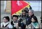 President George W. Bush poses for photos with a Mongolia horseman and other participants of a cultural event in Ikh Tenger, near the capital city of Ulaanbaatar, during a visit Monday, Nov. 21, 2005, by the President and Mrs. Bush.  White House photo by Paul Morse