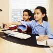 Girl pointing at computer screen