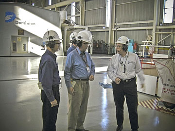 Bruce Mallett, NRC deputy EDO for Reactor and Preparedness Programs (center) and Len Wert (left), director of  Division of Reactor Projects in Region II, talk with North Anna personnel about the operation of their nuclear power plant. The NRC has a comprehensive oversight program for all commercial nuclear power plants to ensure compliance with safety requirements.