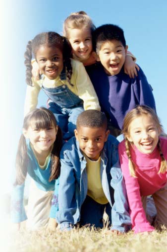 A group of children making a human pyramid