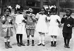 Photo from early 1900s:  six children brushing their teeth 