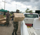 Moving food and water supplies in response to a disaster emergency.