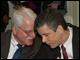 Secretary Arne Duncan confers with Congressman George Miller (California) at the Data Quality Campaign Summit in Washington, D.C.