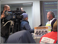 KPCQ TV (Fox) Photojournalist Jennifer Cabala interviews R10 Management Division Director and RRCC Operations Chief Bryant Harrison on the scope of operations. FEMA News Photo//Mike Fearnehough