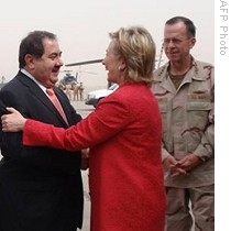 US Secretary of State Hillary Clinton is greeted by Iraqi Foreign Minister Hoshyar Zebari upon her arrival at Baghdad&amp;#39;s International Airport, 25 April 2009