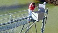 Research technician at a stream gage. 