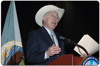 Secretary of the Interior Ken Salazar reads the first bid in the Central Gulf of Mexico Lease Sale 208, which attracted $703,048,523 in high bids from 70 companies for Outer Continental Shelf oil and gas parcels. The sale was held in the New Orleans Superdome on March 18, 2009.  [Photo Credit: Tami Heilemann, DOI-NBC]