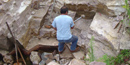 A quarrier working in his quarry pit