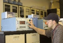 Technician Reading an Air Monitoring Device