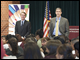 Secretary Arne Duncan and Senator Michael Bennet speak to high school students at Bruce Randolph  School in Denver, Colo.