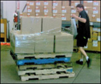 When manually wrapping pallets, elevate them to avoid awkward positions. 