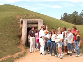 School group visiting the Earth Lodge.